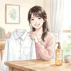 クレンジングオイルで綺麗になった服を手に持って喜ぶ女性
