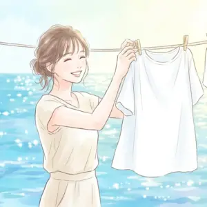 マイクロプラスチック不使用洗剤で洗った白い服を干す笑顔の女性と美しい海の風景